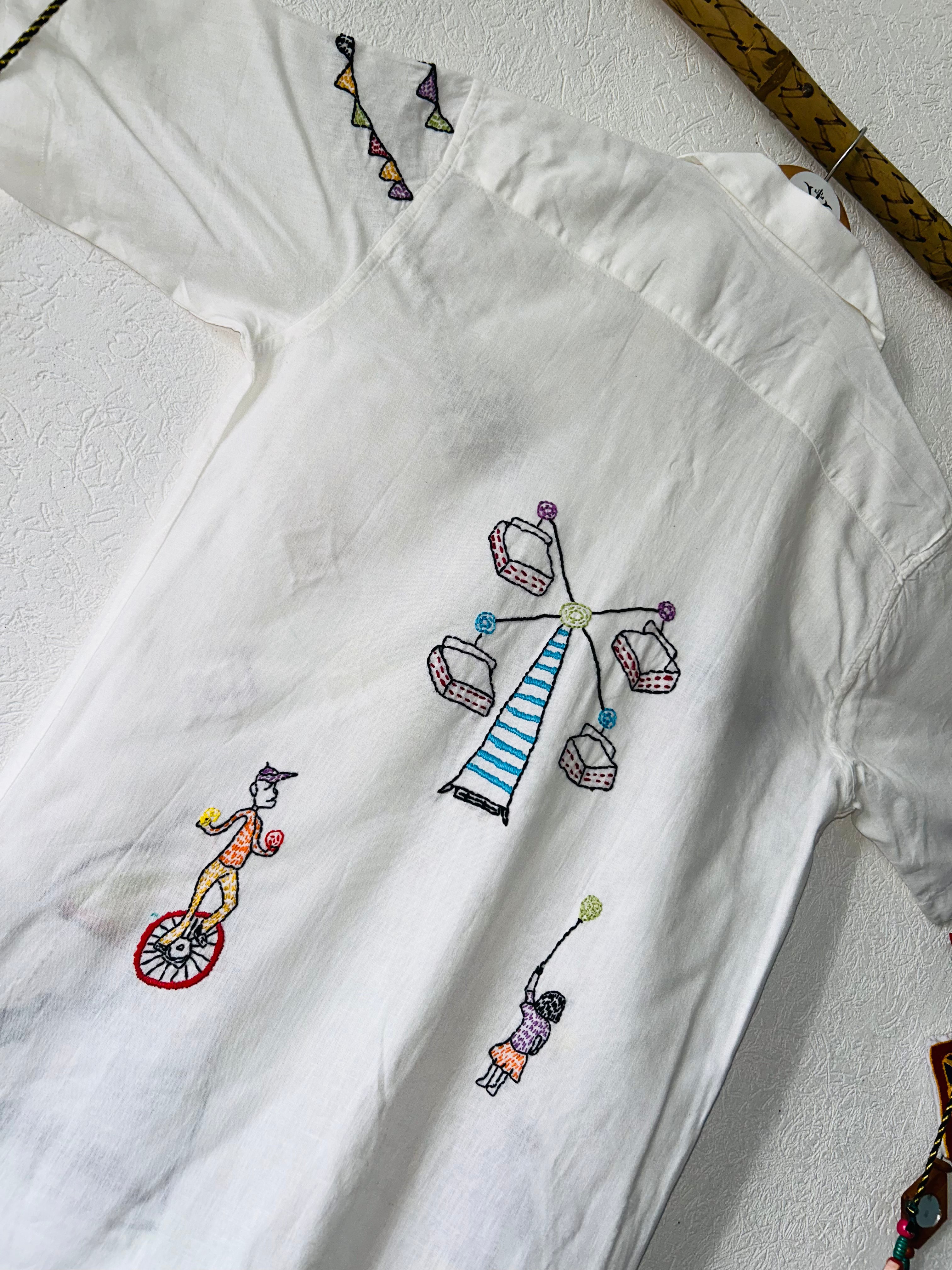 white embroidered shirt with Festive Fairground Design